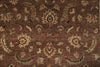 Load image into Gallery viewer, A close-up of a traditional patterned rug with a warm brown background and cream, beige, and muted red floral motifs.