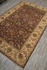 Load image into Gallery viewer, A traditional oriental area rug with a brown center and beige borders, laid out on a gray wood-look floor.