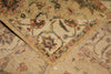 Load image into Gallery viewer, A close-up of a traditional oriental rug with a beige base and intricate floral motifs in muted red, blue, green, and brown tones.