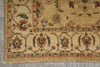 Load image into Gallery viewer, A close-up of an ornate area rug showing its detailed floral pattern and fringed edge, laid out on a gray tiled floor.