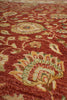 Load image into Gallery viewer, Close-up of a traditional patterned rug with a warm rust-red background and cream, beige, and muted green floral motifs.