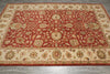 Load image into Gallery viewer, A traditional oriental area rug with an intricate floral pattern, featuring a deep red center field, a beige border, and accents of green, blue, and gold.