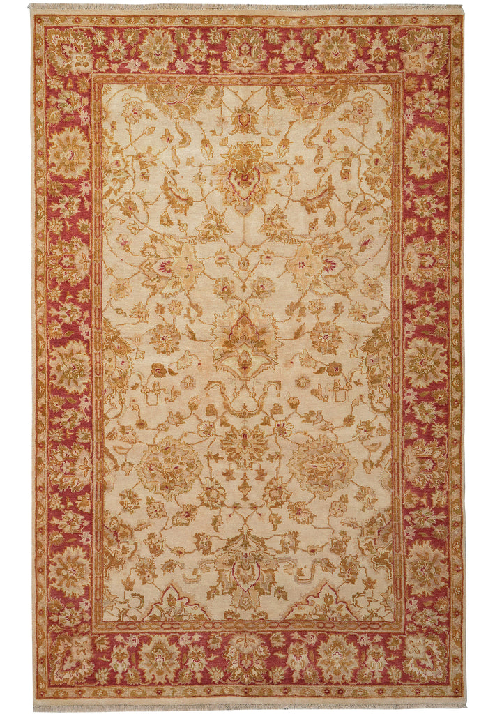 A traditional oriental-style area rug with an intricate floral pattern, featuring a cream center field, a red border, and gold detailing.