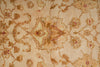 Load image into Gallery viewer, A close-up of a vintage-style floral patterned rug in beige and brown tones with subtle muted red accents.