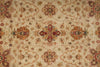 Load image into Gallery viewer, A close-up of an ornate traditional patterned rug with a beige background and intricate floral motifs in rust orange, red, and muted green.