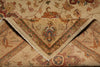 Load image into Gallery viewer, A close-up of a traditional oriental rug with a folded corner showing its beige fringed edge and detailed floral motifs in muted red, green, and blue tones.