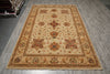 Load image into Gallery viewer, A rectangular traditional area rug with an ornate floral and medallion pattern, displayed on a gray wood-look floor.