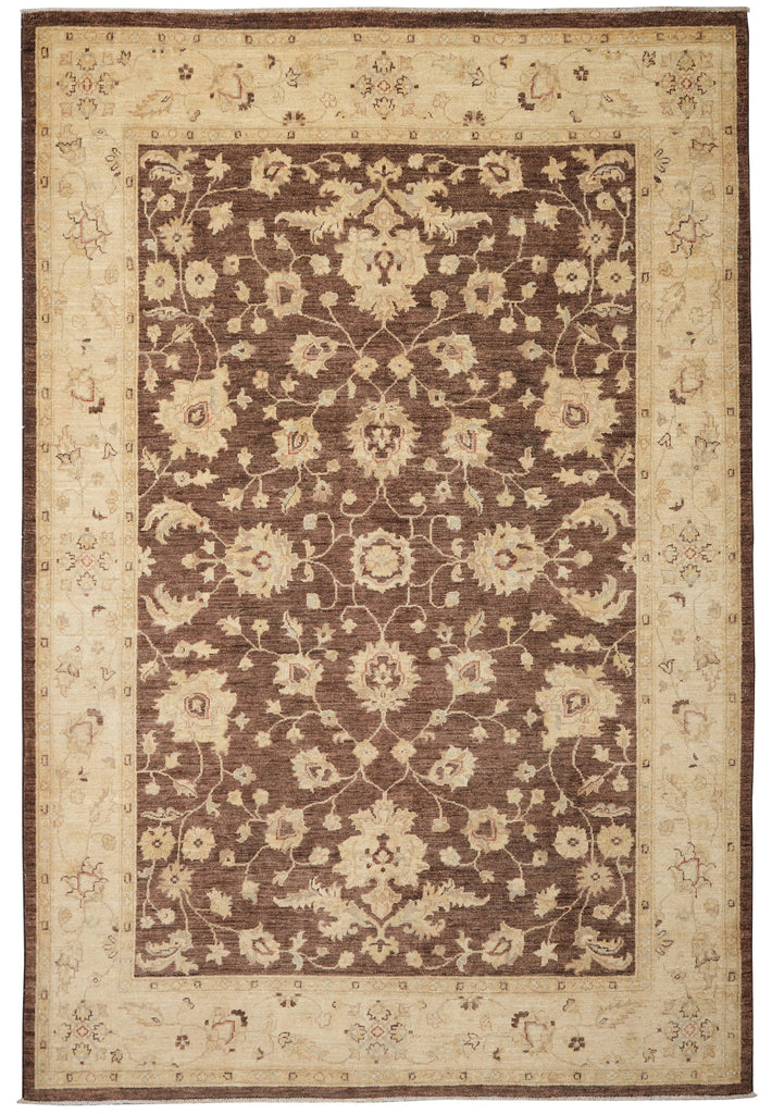 A traditional rectangular area rug with an ornate floral pattern, featuring a dark brown center field, a beige inner border, and a wide cream outer border.