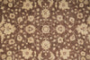 Load image into Gallery viewer, A close-up of a woven rug or textile with an ornate floral and vine pattern in warm beige over a medium brown background.