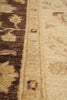Load image into Gallery viewer, Close-up of a patterned rug showing a beige and brown woven design with a decorative border.
