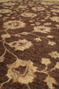 Load image into Gallery viewer, A close-up of a patterned rug or textile with a dark brown base and beige floral motifs.