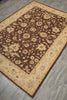 Load image into Gallery viewer, A rectangular area rug with an intricate floral pattern, featuring a dark brown center and a beige border, laid out on a gray wood-look floor.