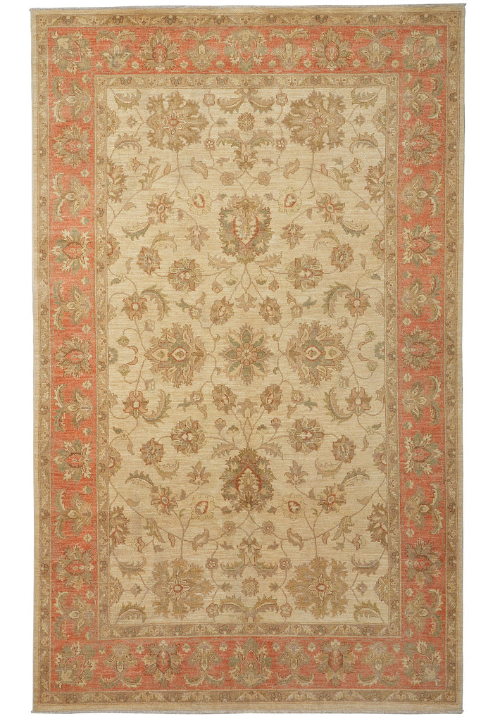 A traditional oriental-style area rug with an intricate floral and medallion pattern, featuring a warm beige center, a coral-red inner border, and a beige outer border.