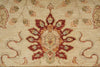 Load image into Gallery viewer, A close-up of a traditional patterned rug featuring a central medallion in rust red, terracotta, and beige, surrounded by floral motifs on a cream-colored background.