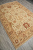 Load image into Gallery viewer, A rectangular area rug with a traditional floral and paisley pattern, shown from an angled overhead perspective on a gray wood-look floor.