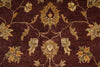 Load image into Gallery viewer, A close-up of a traditional patterned rug featuring a deep burgundy background with ornate floral motifs in beige, gold, and muted green.