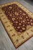 Load image into Gallery viewer, A rectangular area rug with a traditional floral pattern, shown from an elevated angle on a gray wood-look floor. The rug features a deep burgundy central field with beige floral motifs, surrounded by a wide beige border with decorative motifs and a dark burgundy edge.