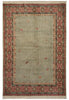 Load image into Gallery viewer, A rectangular area rug with a muted sage green center field, a red and green geometric border, and cream fringe on the top and bottom.