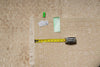 Load image into Gallery viewer, A beige patterned area rug with a fringed edge is shown on a white surface, with a yellow tape measure, small green clips, and handwritten notes placed on top to indicate dimensions.