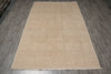 Load image into Gallery viewer, A rectangular beige area rug with a faded traditional floral pattern, laid flat on a gray wood-look floor.