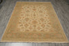 Load image into Gallery viewer, A rectangular area rug with an intricate traditional floral pattern, featuring a beige center, a muted sage green border, and accents of rust orange and brown, laid out on a gray wood-look floor.