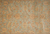 Load image into Gallery viewer, An area rug with an intricate traditional floral and paisley pattern in muted tones of sage green, beige, and terracotta orange.