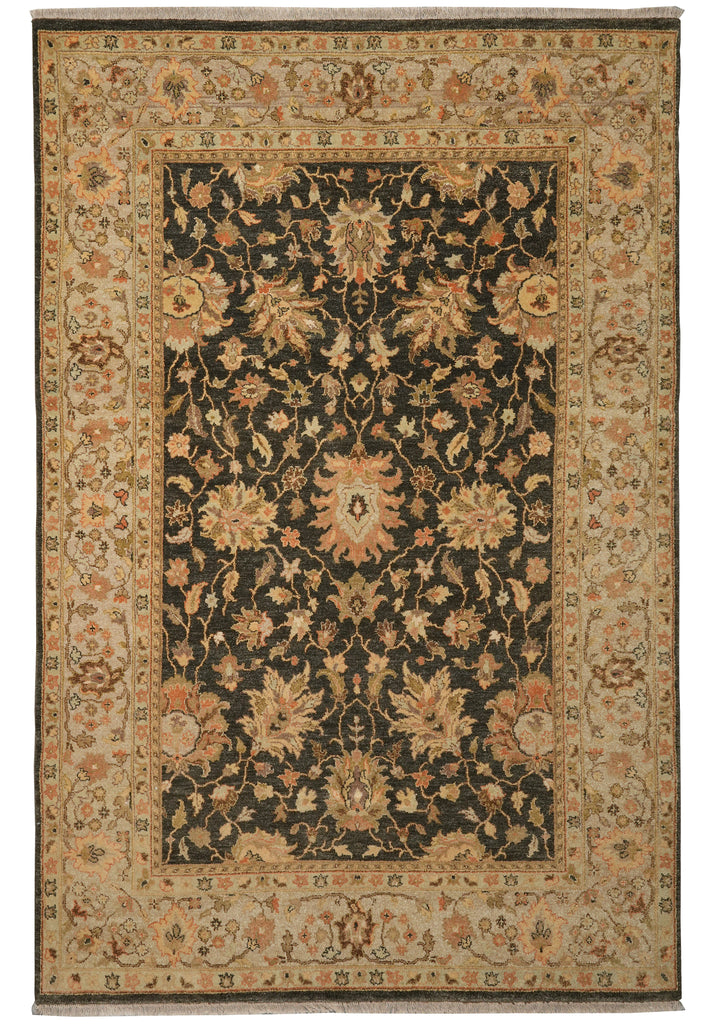 An oriental area rug with a traditional floral pattern, featuring a dark central field surrounded by a beige border.
