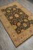 Load image into Gallery viewer, A rectangular area rug with a dark central field and ornate floral motifs, photographed at an angle on a gray wood-look floor.
