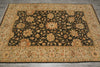 Load image into Gallery viewer, A rectangular area rug with an ornate floral pattern, featuring a dark central field surrounded by a beige border, laid out on a gray tiled floor.