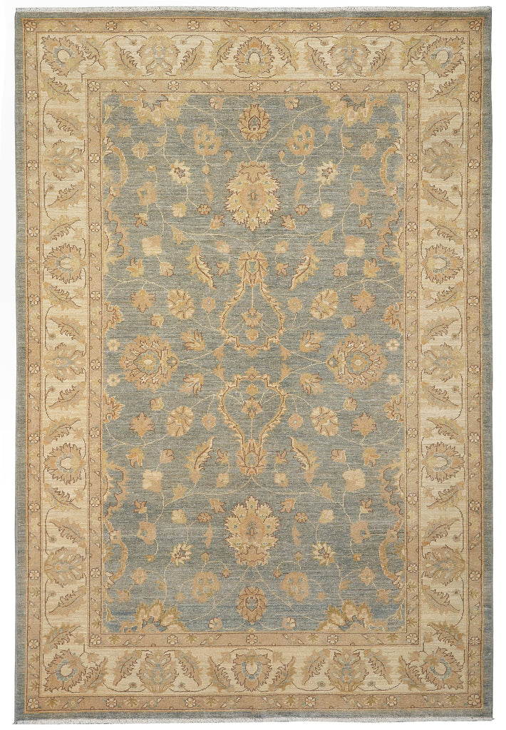 A traditional oriental-style area rug with a dusty blue-gray center field and a beige border featuring ornate floral motifs.