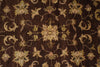 Load image into Gallery viewer, A close-up of a traditional patterned rug with a dark brown background and beige, tan, and muted green floral motifs.