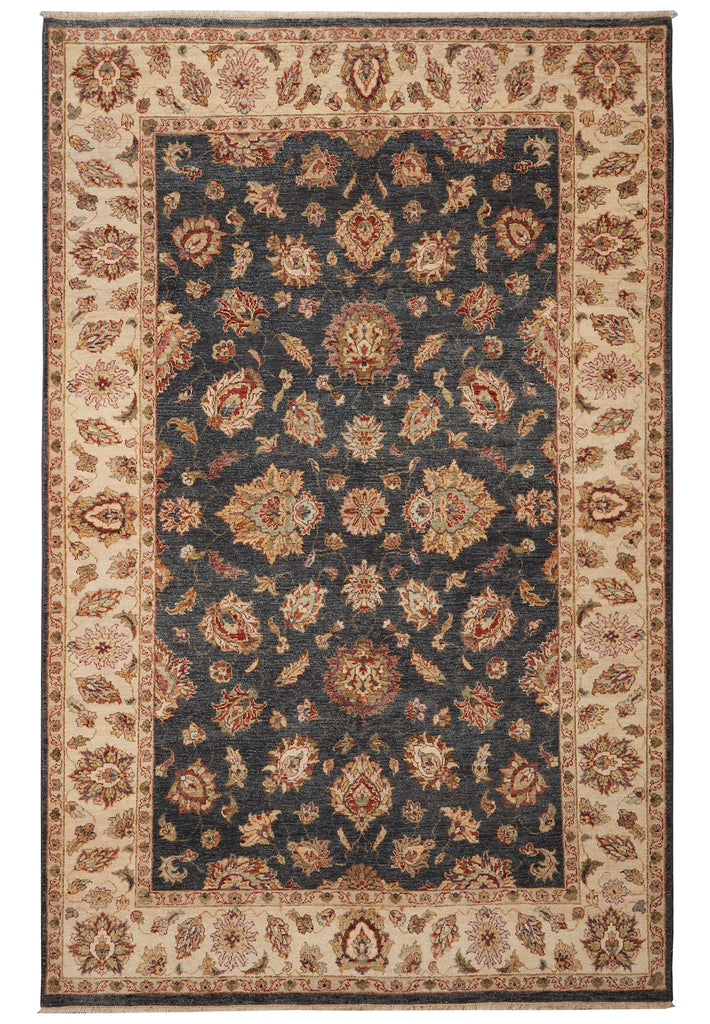 A traditional oriental-style area rug with a dark navy blue central field, beige and cream borders, and intricate floral motifs in rust, tan, and brown.