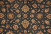 Load image into Gallery viewer, A close-up of a traditional patterned rug or textile with a dark charcoal gray background and ornate floral medallions in beige, rust red, and muted green.