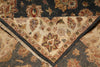 Load image into Gallery viewer, Close-up of a traditional oriental rug corner showing a cream-colored inner field with a floral medallion, a red and beige border, and a dark charcoal-gray outer field with matching floral motifs.