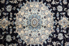 Load image into Gallery viewer, A close-up of an ornate traditional patterned rug with a central medallion and floral motifs in cream, light blue, and black.