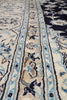 Load image into Gallery viewer, Close-up of an ornate patterned rug with cream, beige, light blue, and dark navy sections, showing detailed woven motifs and borders.