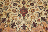Load image into Gallery viewer, A close-up of an ornate Persian-style rug featuring a central medallion and intricate floral motifs in red, blue, green, and brown on a warm beige background.