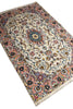 Load image into Gallery viewer, A traditional Persian-style area rug with an intricate floral pattern, featuring a cream center, a dusty pink border, and accents of blue, green, and gold, shown on a plain white background.