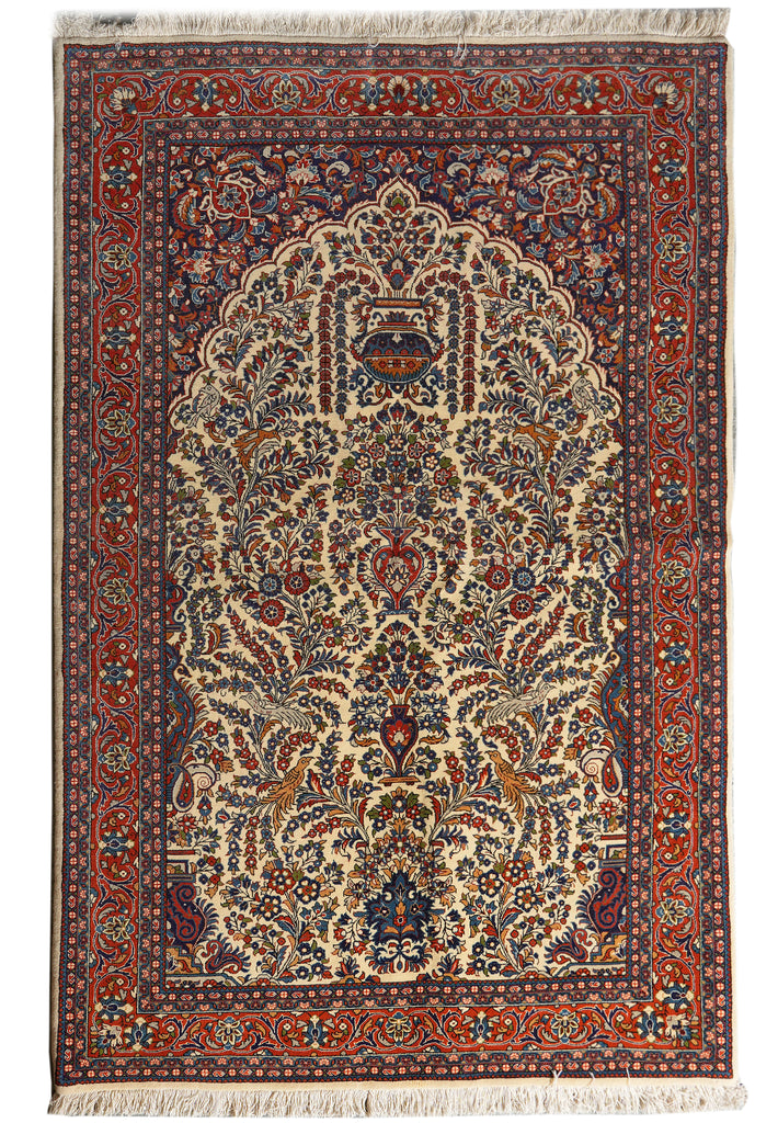 A traditional oriental rug with an intricate floral pattern, featuring a large central medallion, detailed borders, and white fringe on the top and bottom.