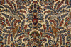 Load image into Gallery viewer, A close-up of an ornate patterned textile or rug featuring a cream background with dense floral motifs in blue, red, green, and gold, plus stylized birds and a central vase design.