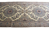 Load image into Gallery viewer, A traditional Persian-style area rug with an intricate floral pattern, featuring a cream background with blue, brown, and beige details.