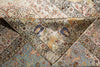 Load image into Gallery viewer, A close-up of an ornate patterned textile or rug folded to show its detailed design. The fabric features traditional motifs in beige, cream, dusty blue, rust red, and navy blue, with a prominent decorative border.