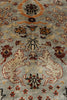 Load image into Gallery viewer, Close-up of an ornate patterned area rug with cream, rust, burgundy, and black motifs on a muted blue-gray field.