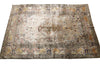 Load image into Gallery viewer, An antique Persian-style area rug with a faded beige and cream base, featuring a central medallion and ornate floral borders in muted brown, blue, and ochre tones.