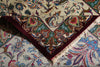 Load image into Gallery viewer, A close-up of a traditional patterned rug with a cream background, deep red border, and intricate floral and paisley motifs in blue, green, and brown.