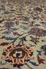 Load image into Gallery viewer, Close-up of an ornate floral patterned rug with cream, blue, green, and rust tones on a beige background.