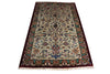 Load image into Gallery viewer, A rectangular traditional area rug with an intricate floral and vine pattern, featuring a cream center field, deep red borders, and multicolored accents, shown flat against a white background.
