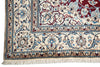 Load image into Gallery viewer, Close-up of an ornate patterned rug corner showing cream, burgundy, blue, and brown floral motifs with a fringed edge.