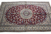 Load image into Gallery viewer, A traditional Persian-style area rug with a deep red central field, cream borders, and intricate blue and beige floral patterns.