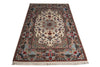 Load image into Gallery viewer, An oriental area rug with an intricate floral and medallion pattern, featuring a cream center, red borders, and blue accents, finished with a fringed edge.